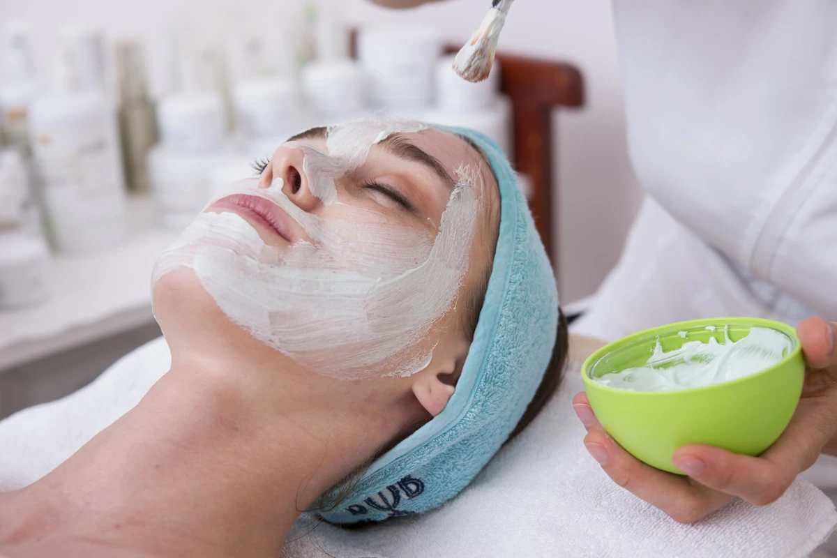 Client receiving a hydrating facial mask treatment at Juniper Reign Aesthetics and Wellness